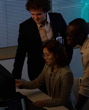 Cyber security professional working at a computer